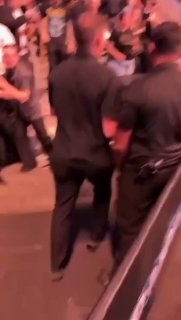 Police officer knocks out fan during brawl at Canada event